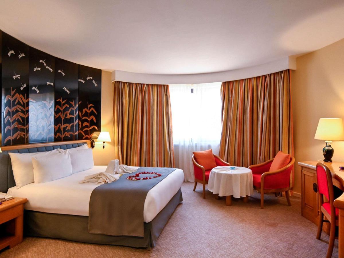 โรงแรมแกรนด์โฮเต็ลเมอร์คูเร่อัลเจอร์ แอร์โร่พอร์ท Maison Blanche ภายนอก รูปภาพ A room at the hotel