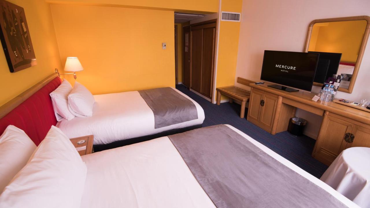 โรงแรมแกรนด์โฮเต็ลเมอร์คูเร่อัลเจอร์ แอร์โร่พอร์ท Maison Blanche ภายนอก รูปภาพ A typical room at a Mercure hotel